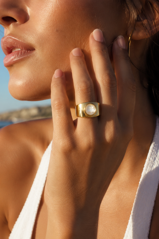 Maya Pearl Center Ring, worn on a finger in close-up