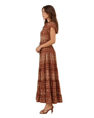 Nina Batik Print Tiered Maxi Dress in rust, side view showing the tiered skirt and short sleeve