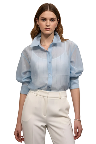 Radiance Button Down Shirt in blue, front view worn over a camisole with white trousers and gathered sleeves