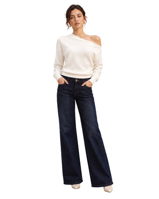 The Ultra Soft One Shoulder Sweater – front view on model, ivory, worn with dark jeans