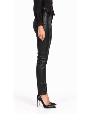Greta Vegan Leather Coated Jeans in black, side view with slim leg and pointed heels