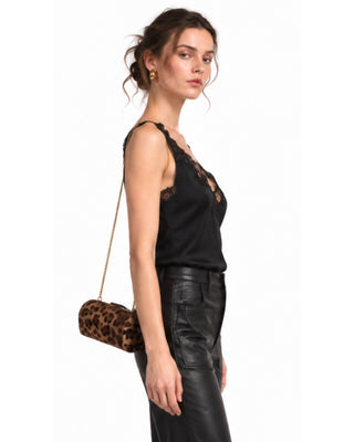 Pricilla Lace Trimmed Satin Top in black, side view with lace-edged neckline and leopard crossbody bag