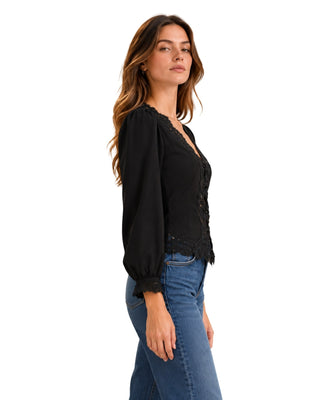 Lucia Long Sleeved Lace Trim Blouse in black, side view with puff shoulder and lace cuff
